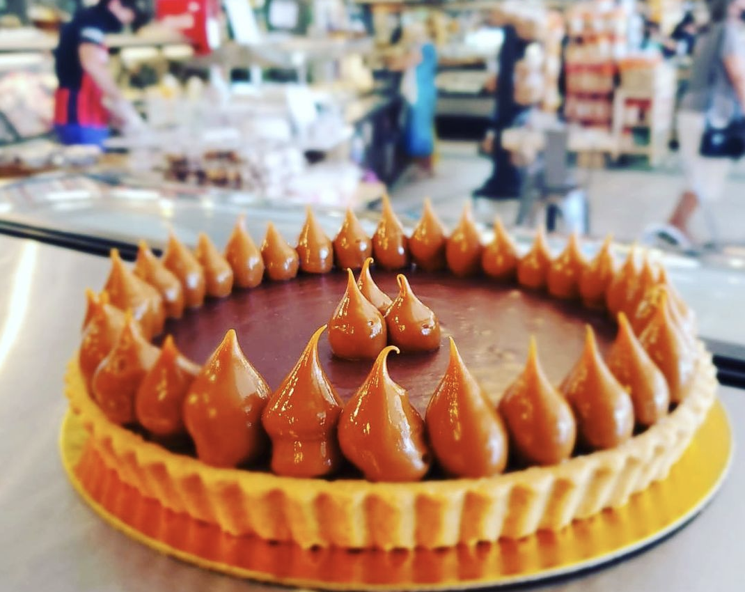 Leave room after your Key Biscayne Sunday meal… | Lifestyle 8 Golden Hog Dark chocolate dulce de leche tart.png